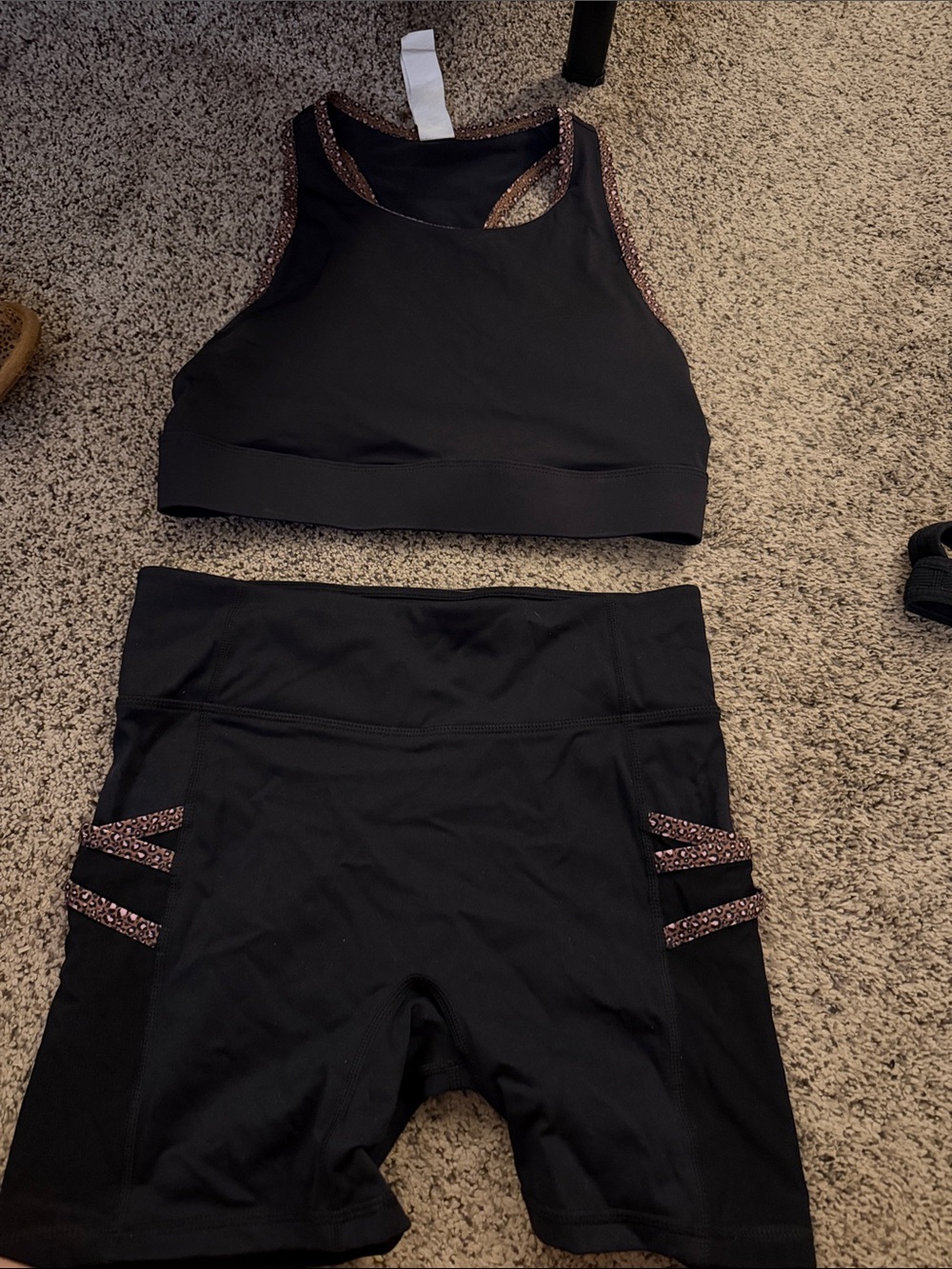 Fabletics Black High-Neck Sports Bra and Black Shorts with Rose Gold Trim